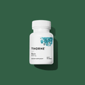 Thorne Biotin by Thorne, biotin capsules in premium supplement bottle with front label packaging.